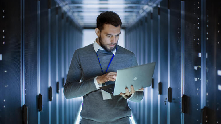 Network administrator working in data center