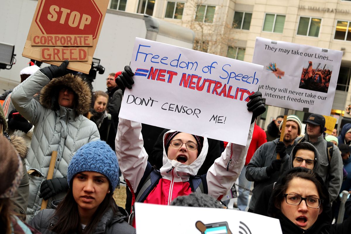 Demonstrators rally outside the Federal Communication Commission building to protest against the end of net neutrality rules December 14, 2017 in Washington, DC. 