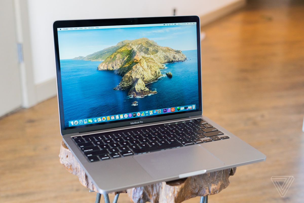 A 2020 Apple MacBook Pro 13-inch with the display on and keyboard visible