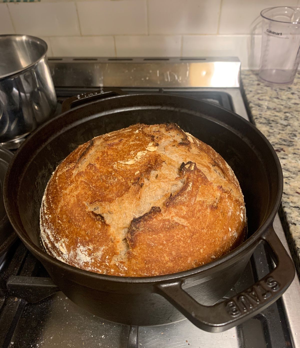 A loaf of bread in a Dutch oven.