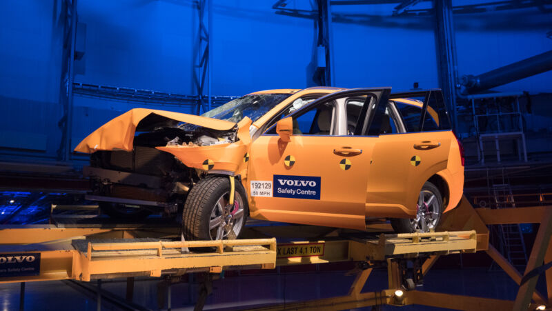 An orange Volvo SUV after a crash test.